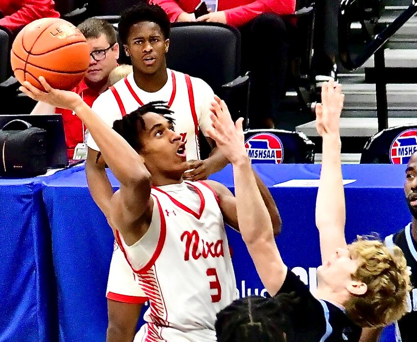 NIXA'S RANDY FLINT takes aim at the bucket.
