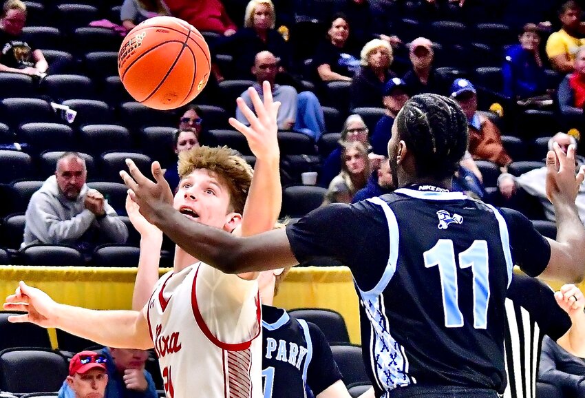 NIXA'S ADAM MCKNIGHT tracks down a rebound.