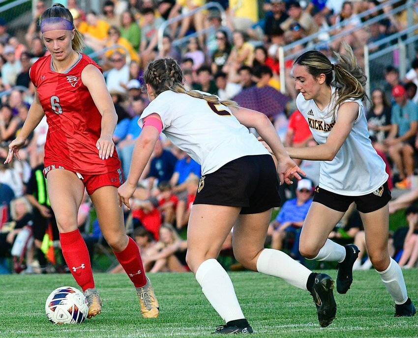 NIXA'S SHAELEE FRANCK sets herself up for a goal against two Kickapoo defenders Monday.