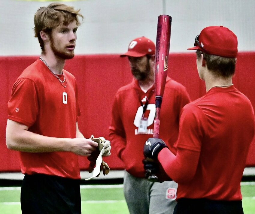 OZARK'S COOPER PUMPHREY AND RYLAN SUTTON get set for a practice at the Tigers' indoor facility.
