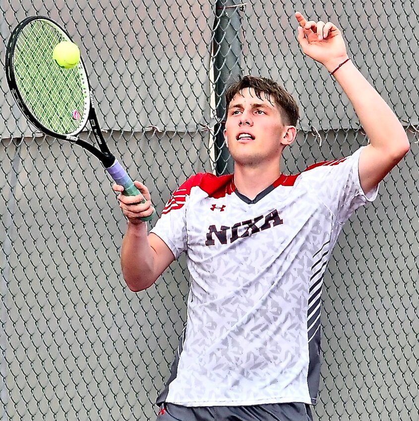 NIXA'S GAGE HASSON eyes a forehand return.