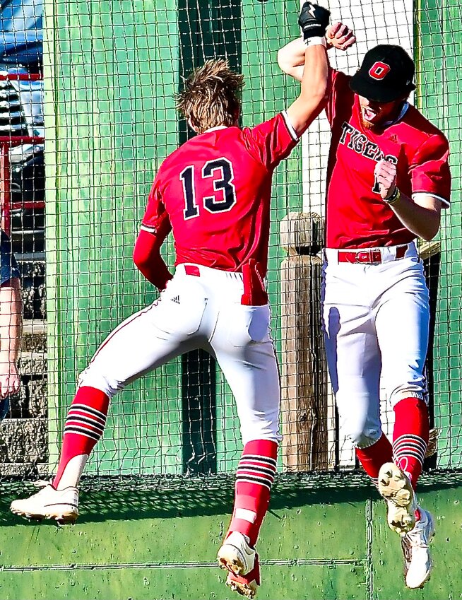 OZARK'S RYLAN SUTTON AND COOPER PUMPHREY celebrate a Sutton home run.