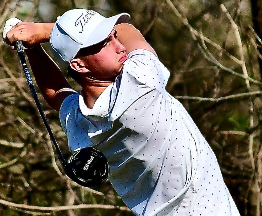 NIXA'S NOAH SCHIMAN watches the flight of his tee shot during the Rumble on the River at Rivercut Golf Course on Thursday