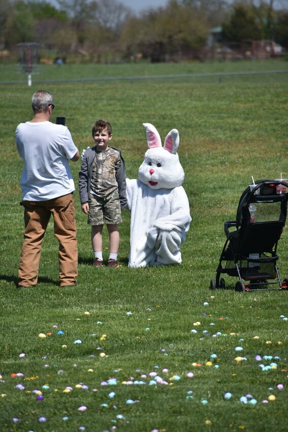 A young egg hunter poses for a picture with the Easter Bunny during the Sparta Easter Egg Hunt on Saturday, April 12. The Easter Bunny was a guest of honor at the event. (Photos by Steve Chapman)