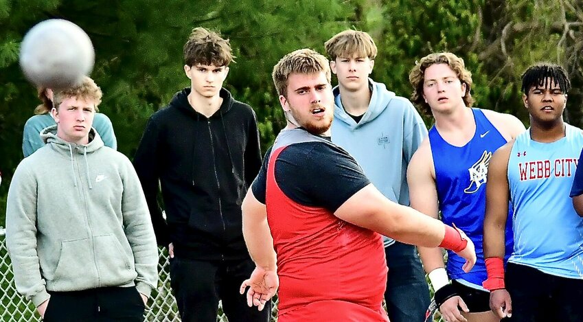NIXA'S HAYDEN MAYS watches the flight of his throw in the shot put.