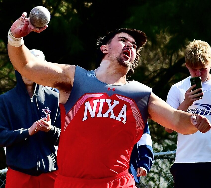 NIXA'S JACKSON CANTWELL heaves the shot put at the Jim Vaughan Invitational in Springfield.