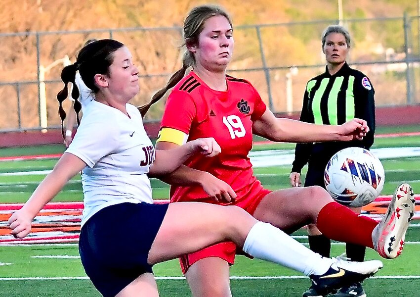 OZARK'S AUDREY CARLTON makes a pass against Joplin on Tuesday.