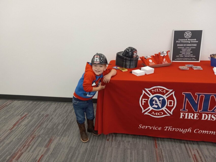 Zayne Lovell, 3, son of Lt. David Lovell and Holly Lovell, hangs out in the meeting room during the Nixa Fire Training Center&rsquo;s open house. All photos by Steve Chapman.