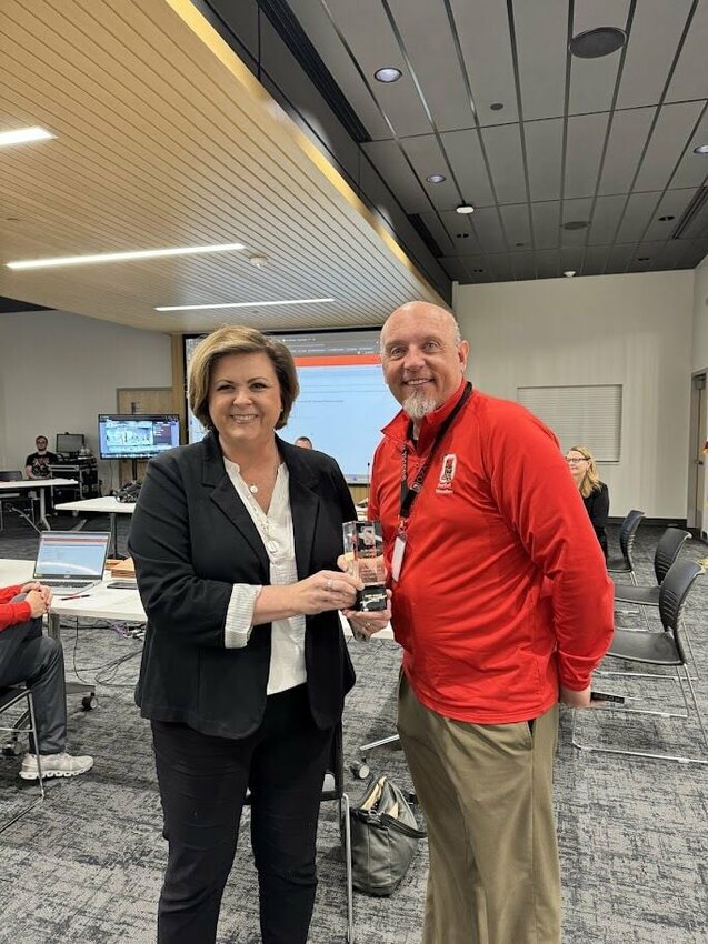 Newly elected Ozark School Board member Rae-Ann Wade poses for a picture with former Board President Mark Jenkins. Photo courtesy of Ozark Public Schools.