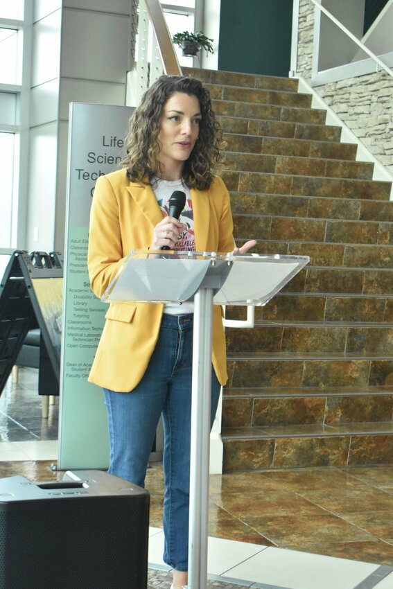 Bailey Pyle, director of Be Well Initiatives at Burrell Behavioral Health, addresses the audience during the unveiling of the Be Well Bell. Photos by Steve Chapman.