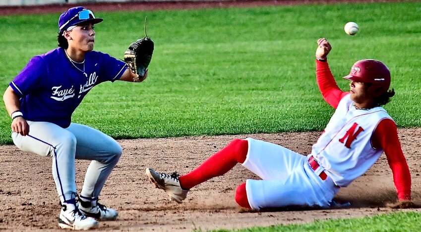 NIXA'S WYATT VINCENT beats a throw to second base.