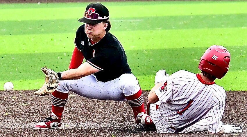 OZARK'S DREW HAYWARD catches a throw as a Glendale runner steals second base Tuesday.