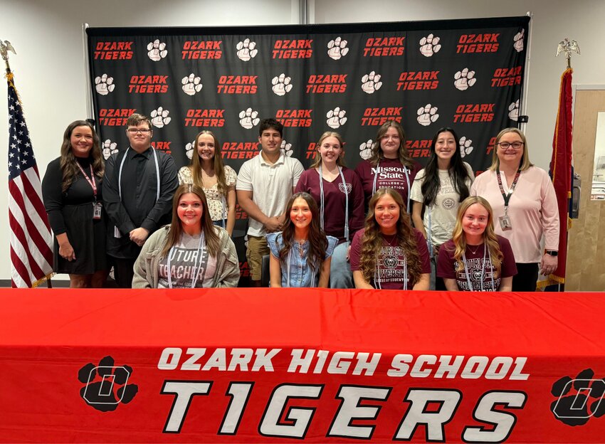 Ozark High School students who have committed to careers in education pose for a group photo after they were recognized at their college signing ceremony. Photo courtesy of Ozark Public Schools.