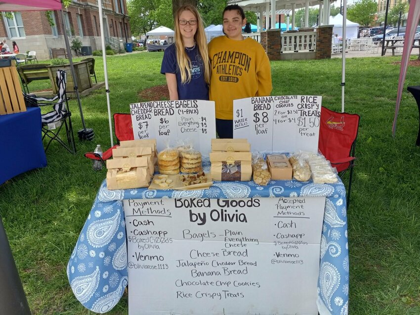 Olivia Smith (right) sells her homemade baked goods on the square with a little help from her sister, Kennedy Hodgson, 11. All photos by Steve Chapman.