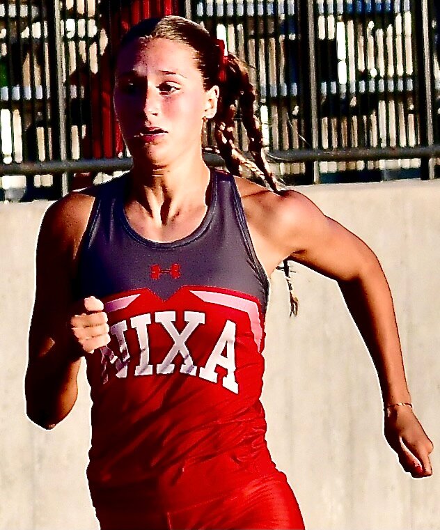 NIXA'S TAYLOR HOPPER eyes the finish line in the 200.