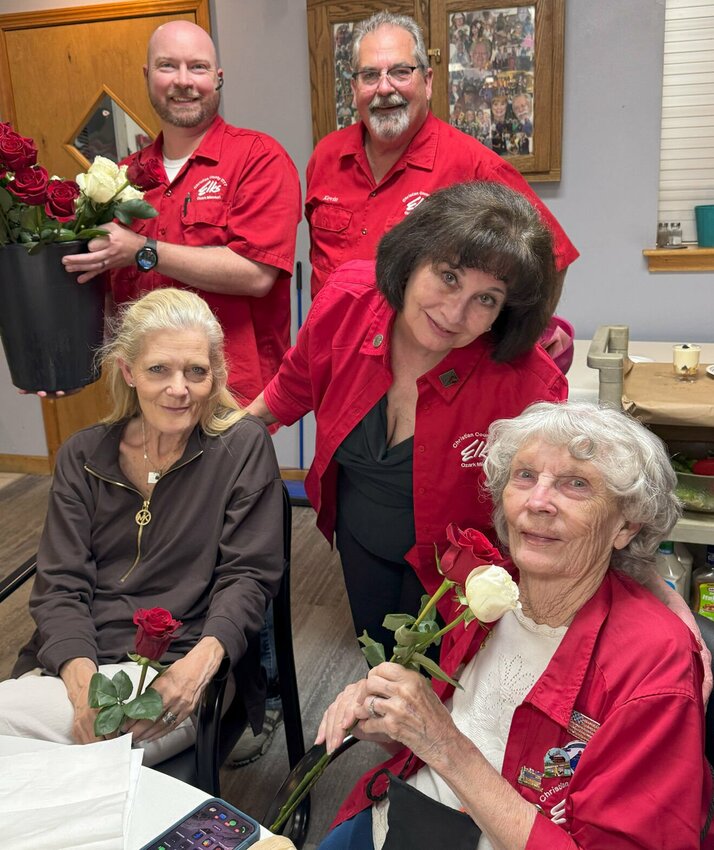 Susan Fox (seated) with her 91-year-old mother, Frances, both from Ozark received roses from Lodge Treasurer Jerry Fritchman, Esquire Michael Sweet (left) and Exalted Ruler Kevin Wolfe. Photo courtesy of Christian County Elks Lodge #2777.