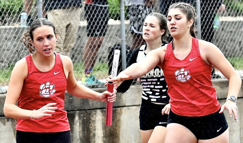 OZARK'S OLIVIA CARPENTER AND BROOKE BOWMAN complete an exchange.