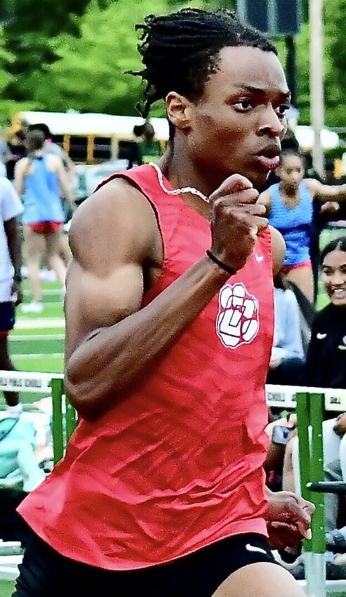OZARK'S KANNON WILLIAMS races to a first in the 200 at last week's COC Meet.