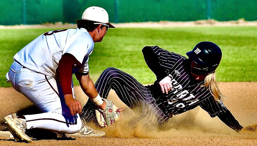 SPARTA'S PHOENIX HOLT is caught stealing at second base by Seymour in Class 3 District 10 action Friday.