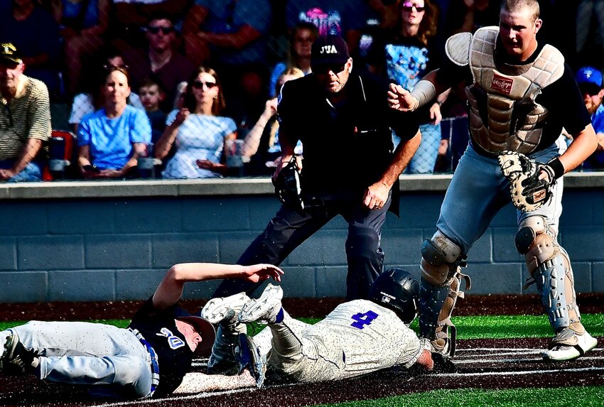 CLEVER'S BRECKEN VESTAL tags out a Fair Grove baserunner trying to score on a wild pitch.
