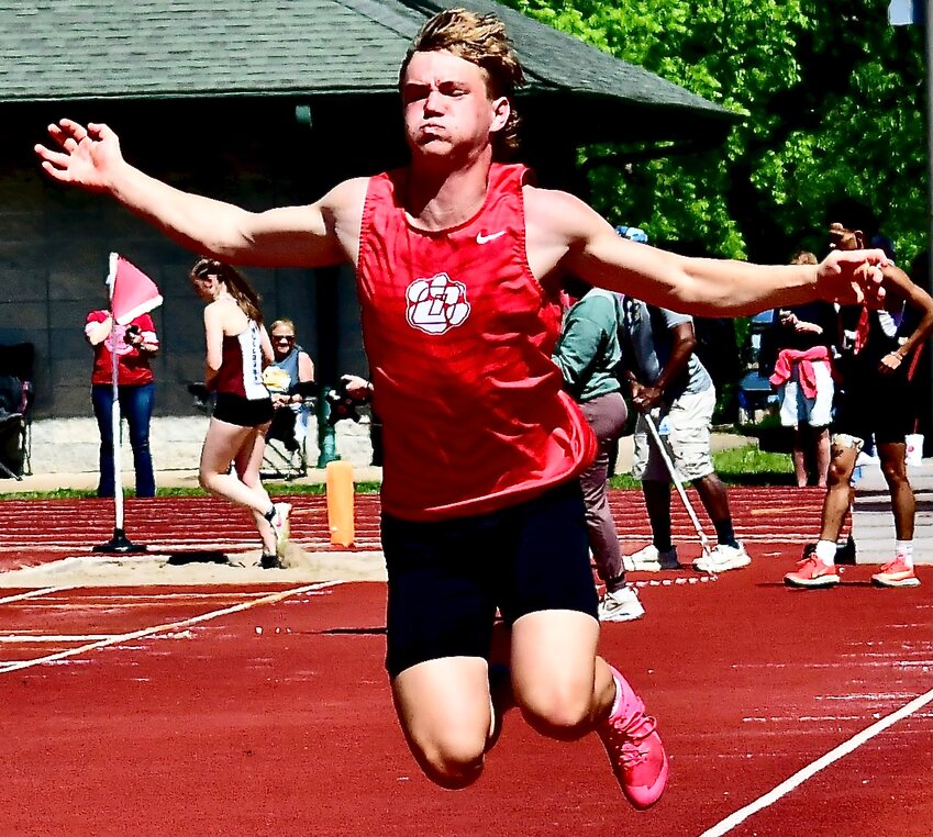 OZARK'S JETT EASLEY competes in the long jump earlier this spring.