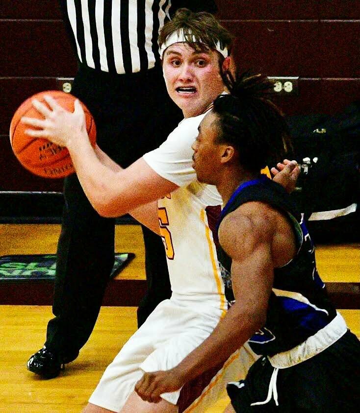 SPOKANE'S ETHAN NEWELL looks to score during his junior basketball season.