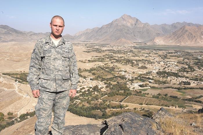 Submitted photoStaff Sgt. Mike Davis, an Air Force broadcaster, stands amidst a desert backdrop on his way to shoot a news story on the Afghan National Military Hospital in Kabul, Afghanistan.