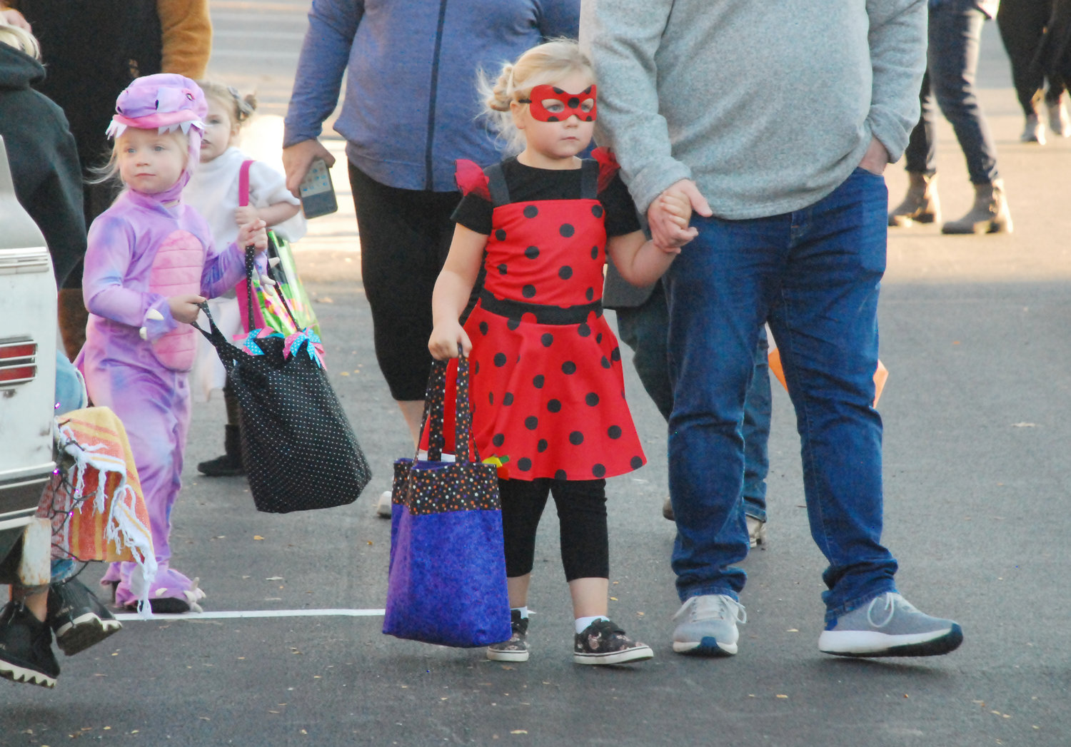 TRICK-OR-TREATERS walked around the Ozark square collecting candy from volunteers as part of a safe trick-or-treating event held annually by by the 4C Sertoma Club, participating businesses and civic organizations and emergency responders.