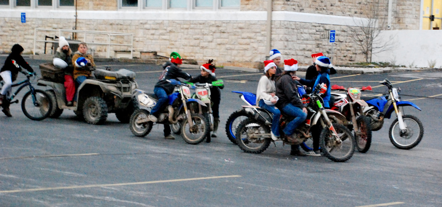 MOTORCYCLISTS and ATV riders stage at Sparta Middle School before their ride south on North Oak Avenue in the Sparta Christmas Parade.