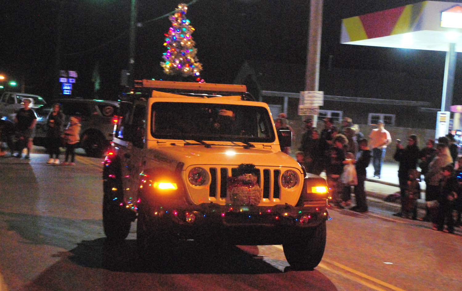 WON COMMUNICATIONS FOUNDER MATTHEW THOMAS drives in a Jeep Wrangler in the Sparta Christmas Parade. Thomas is also part of the Sparta Chamber of Commerce.