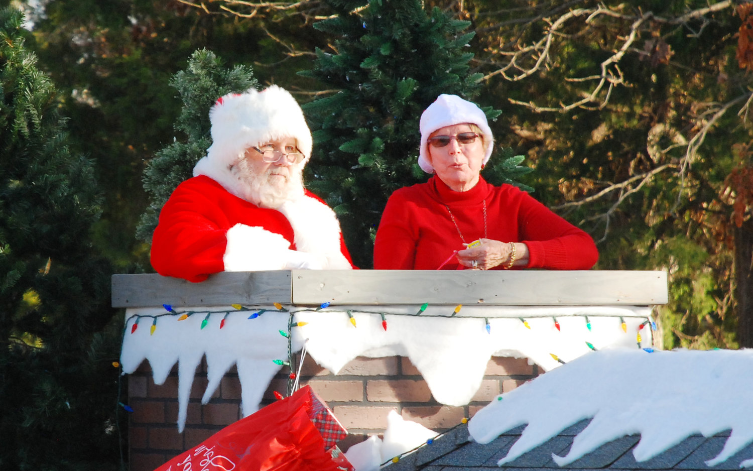 SANTA CLAUS AND MRS. CLAUS ride in a float near the end of the 2021 Nixa Christmas Parade. The Clauses visited with Nixa children and families before returning to the North Pole in preparation for Dec. 25.