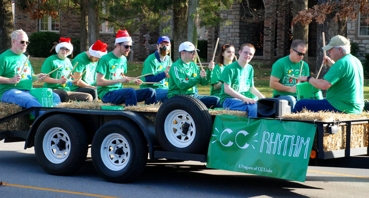 CC RHYTHM, a group of percussionists from the CC Links organization, played holiday songs while riding on a parade float.