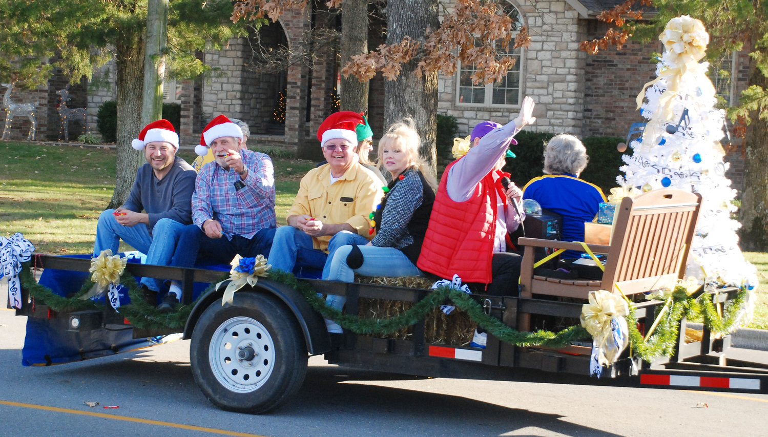 THE CHRISTIAN COUNTY LIONS CLUB waves to spectators.