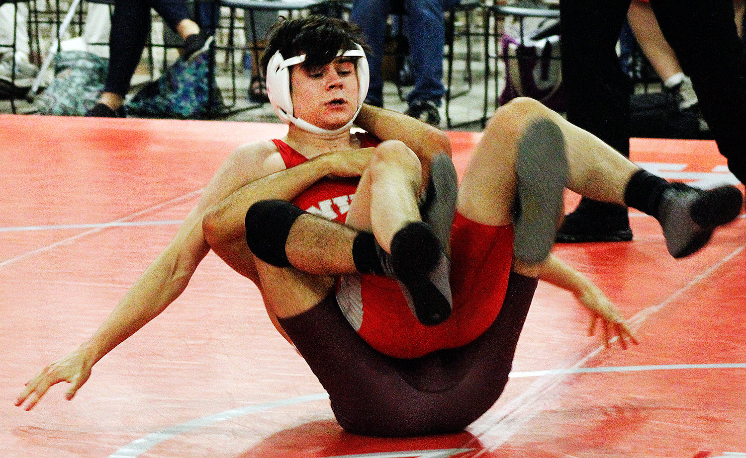 NATE BROWER keeps his balance against a Rogersville opponent.