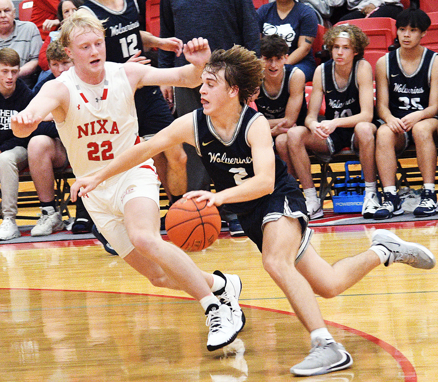JARET NELSON keeps pace with a Bentonville West ball-handler.