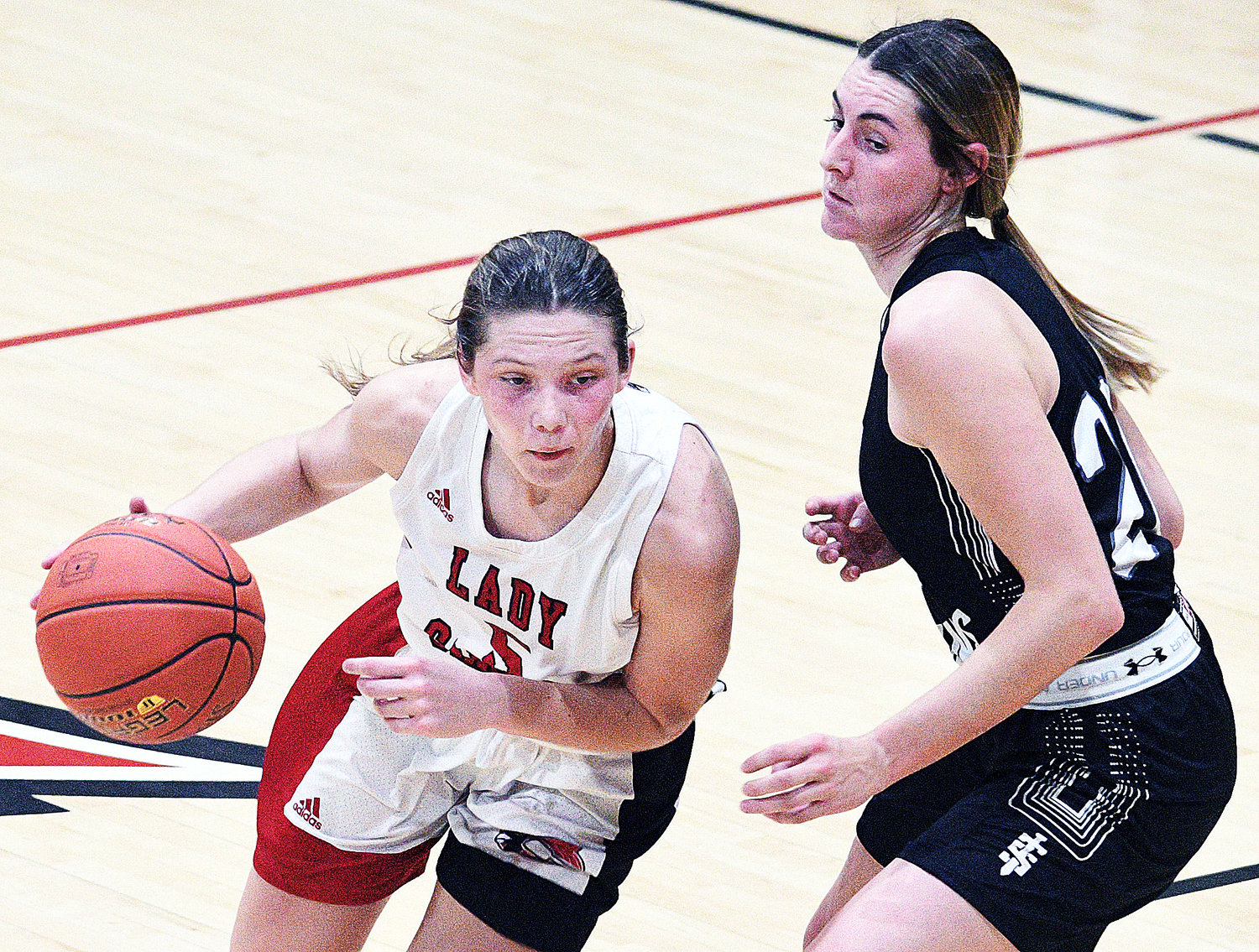 CHADWICK’S RAELIGH LITTLE dribbles around Sparta’s Shelby McMurry.
