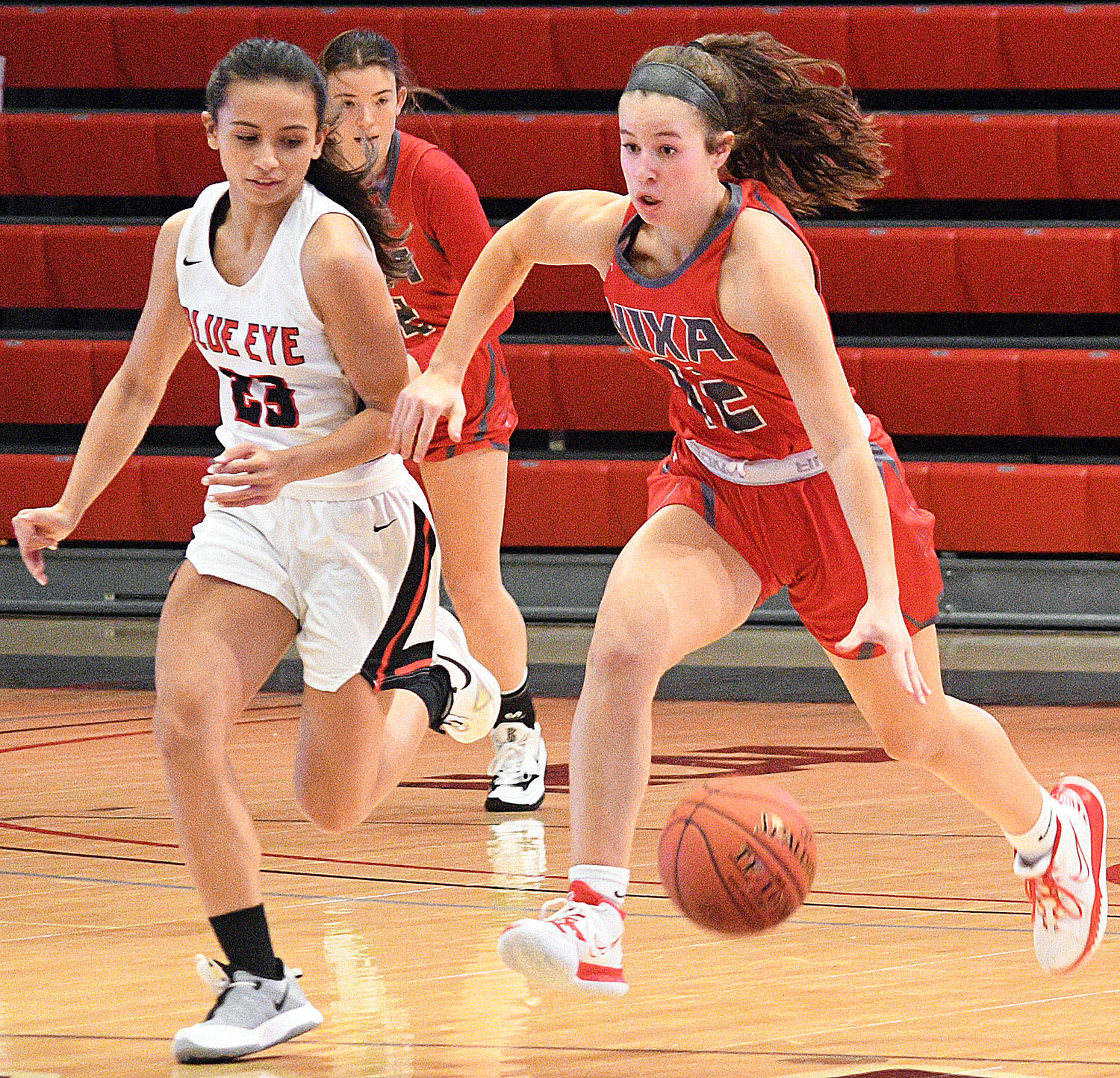 SADIE CONWAY brings the ball upcourt.