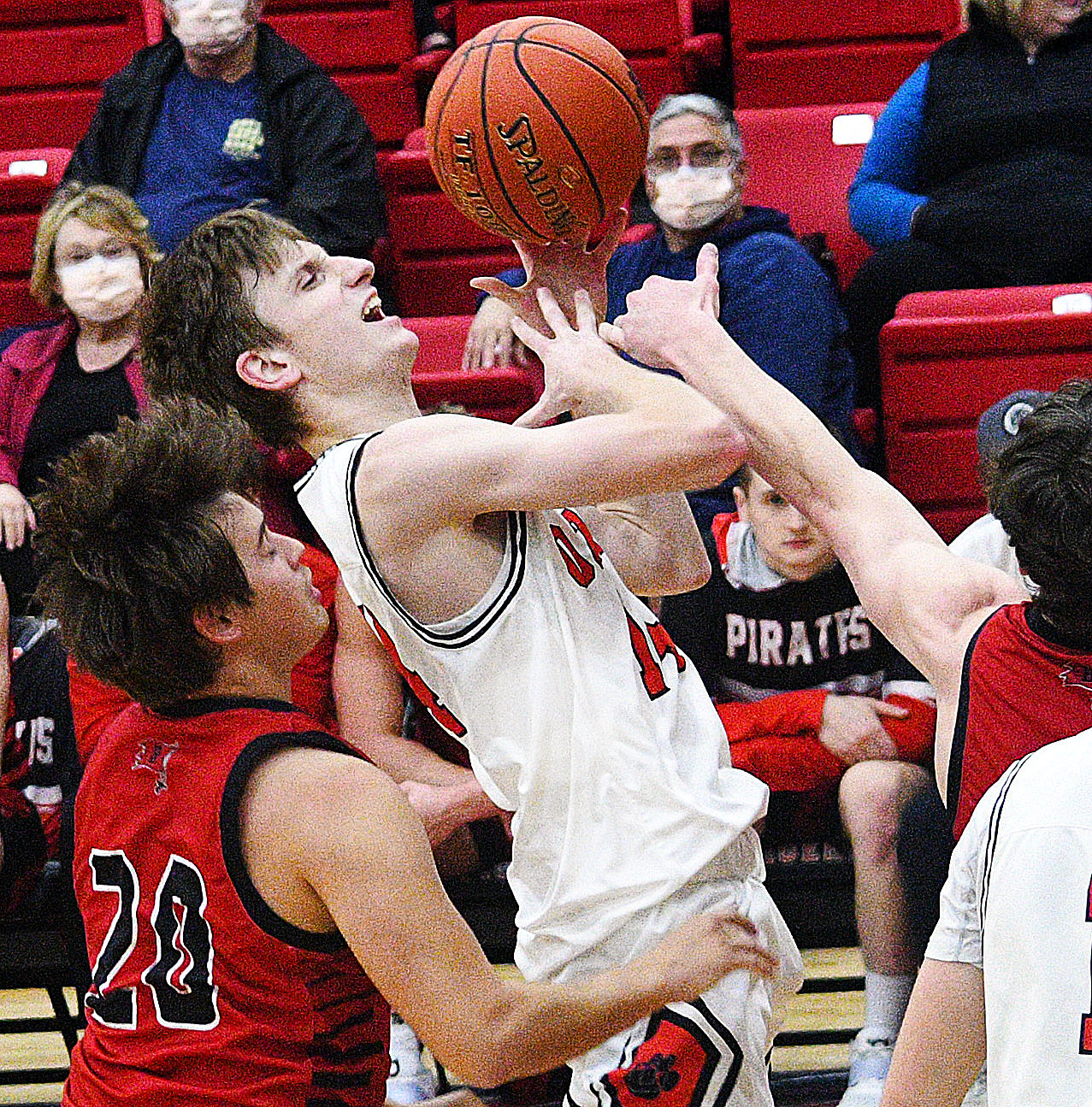 ETHAN WHATLEY is fouled during a shot attempt.