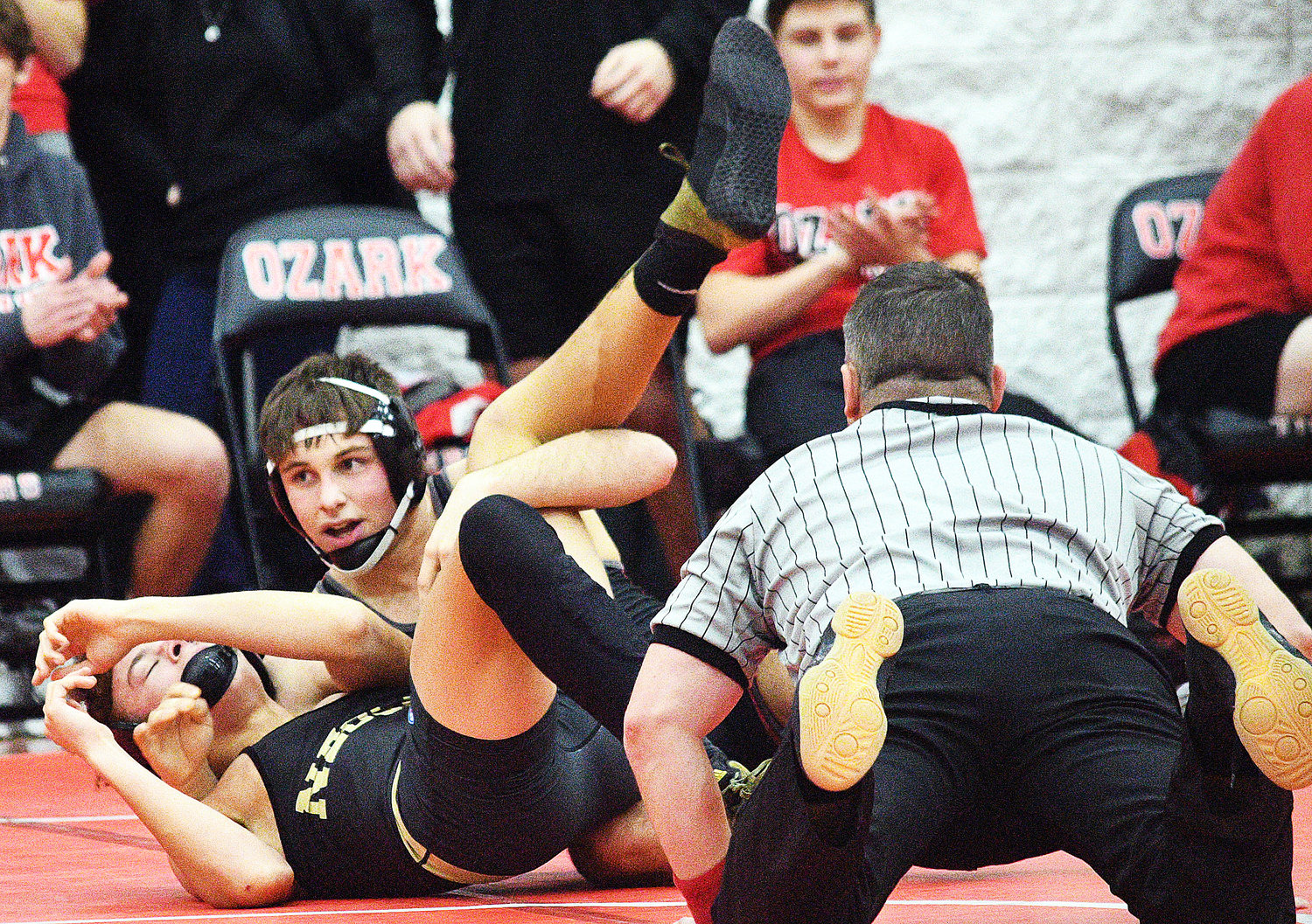 OZARK’S BRAXTON STRICK finishes off a pin in 1:33 during the Tigers’ 50-10 victory versus Neosho.
