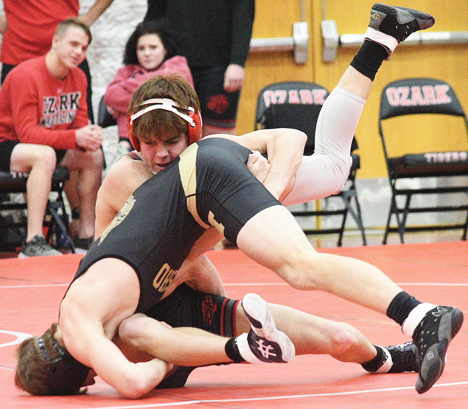 BROCK SUNDLIE battles for position with his opponent.