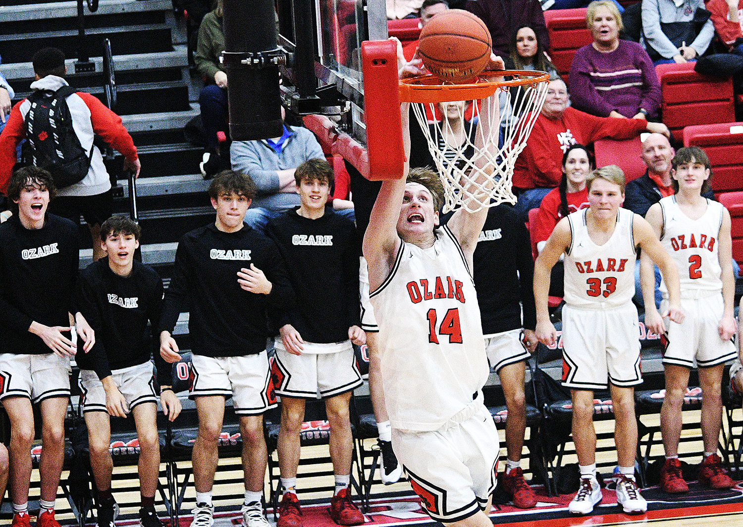 OZARK’S ETHAN WHATLEY follows through for his first career dunk in the Tigers’ win versus Glendale on Friday.
