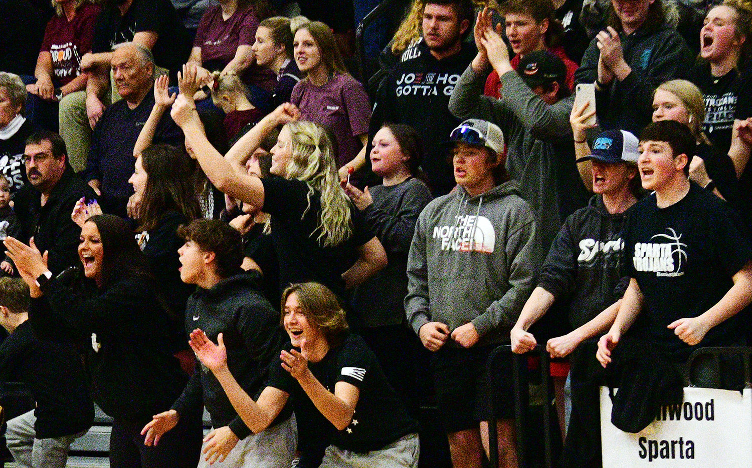 SPARTA FANS cheer on the Lady Trojans.