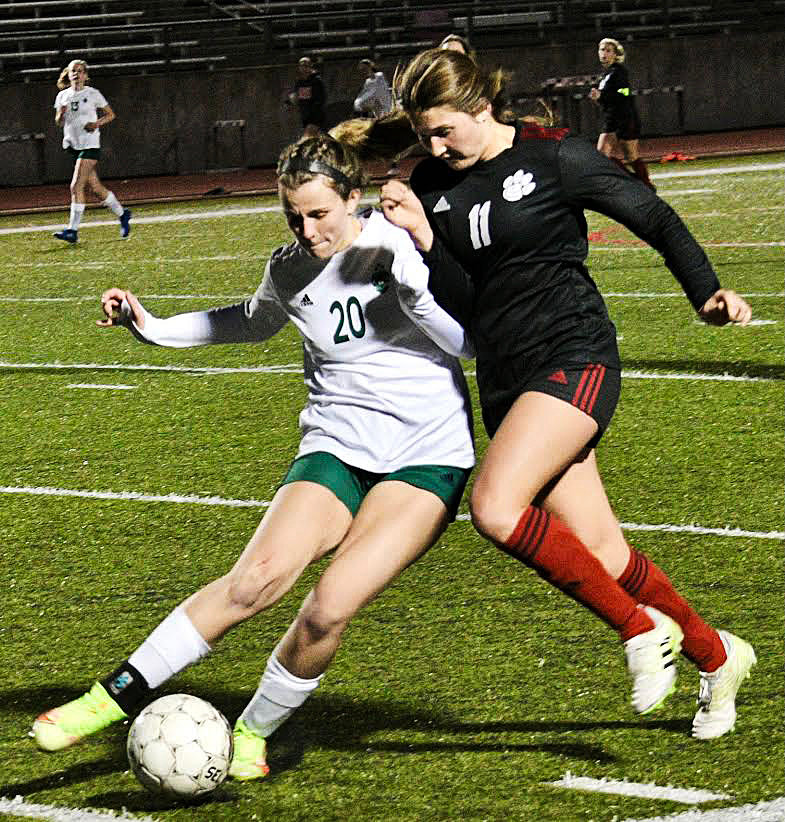 OZARK’S ANNABELLE SHULER tries to steal the ball from a Catholic player.