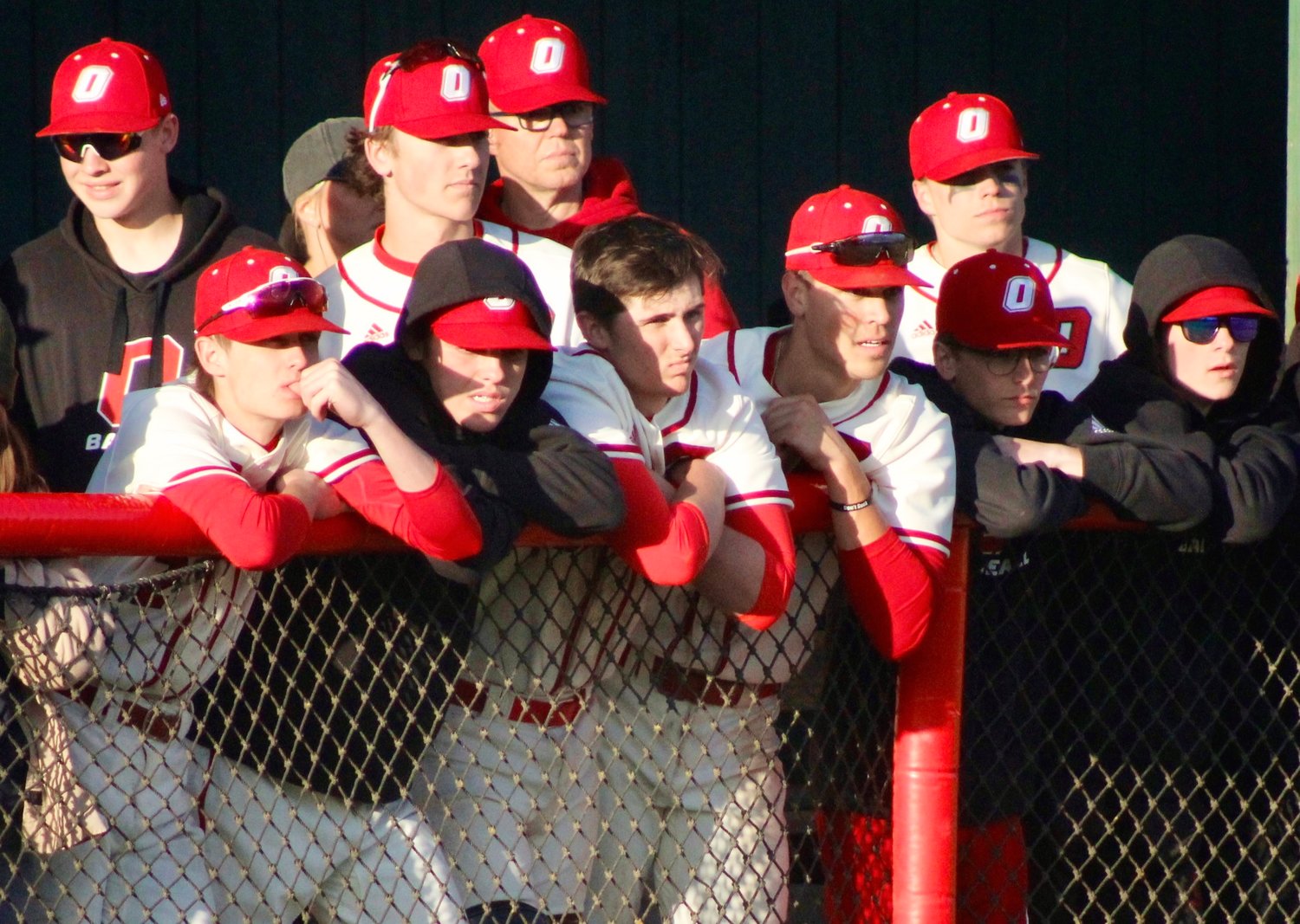 OZARK PLAYERS watch the action from their dugout.