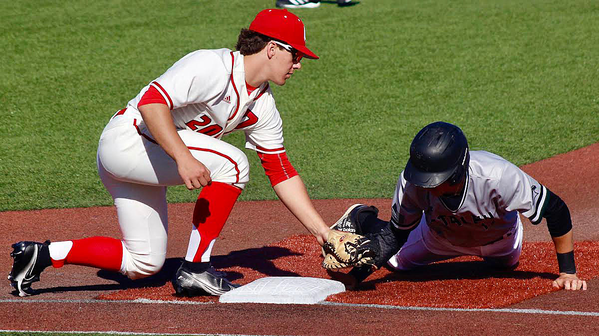 GAGE DEPEE applies a tag at first base on a pick-off attempt.