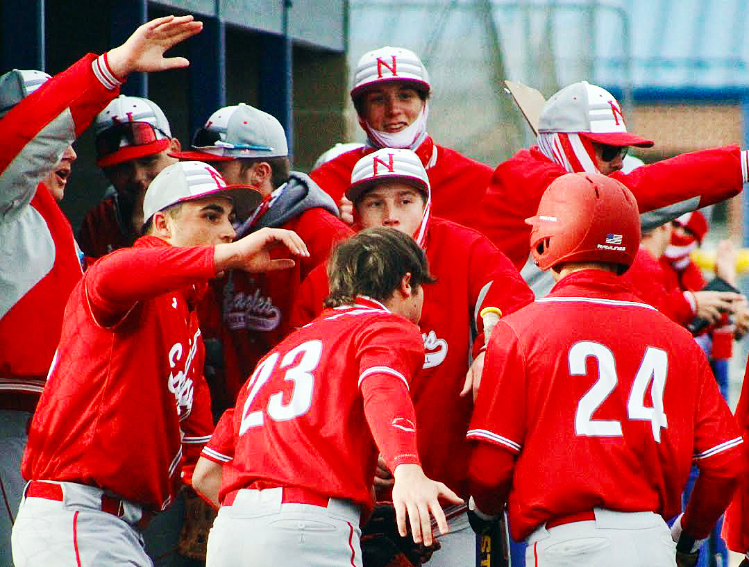 NIXA’S WYATT VINCENT is met by teammates during the Eagles’ 16-6 win against Columbia Hickman over the weekend.