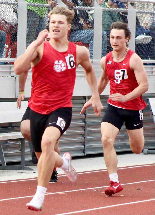OZARK’S WILL SCHEER runs to a victory in his heat in the 100 at the Nixa Relays last week.