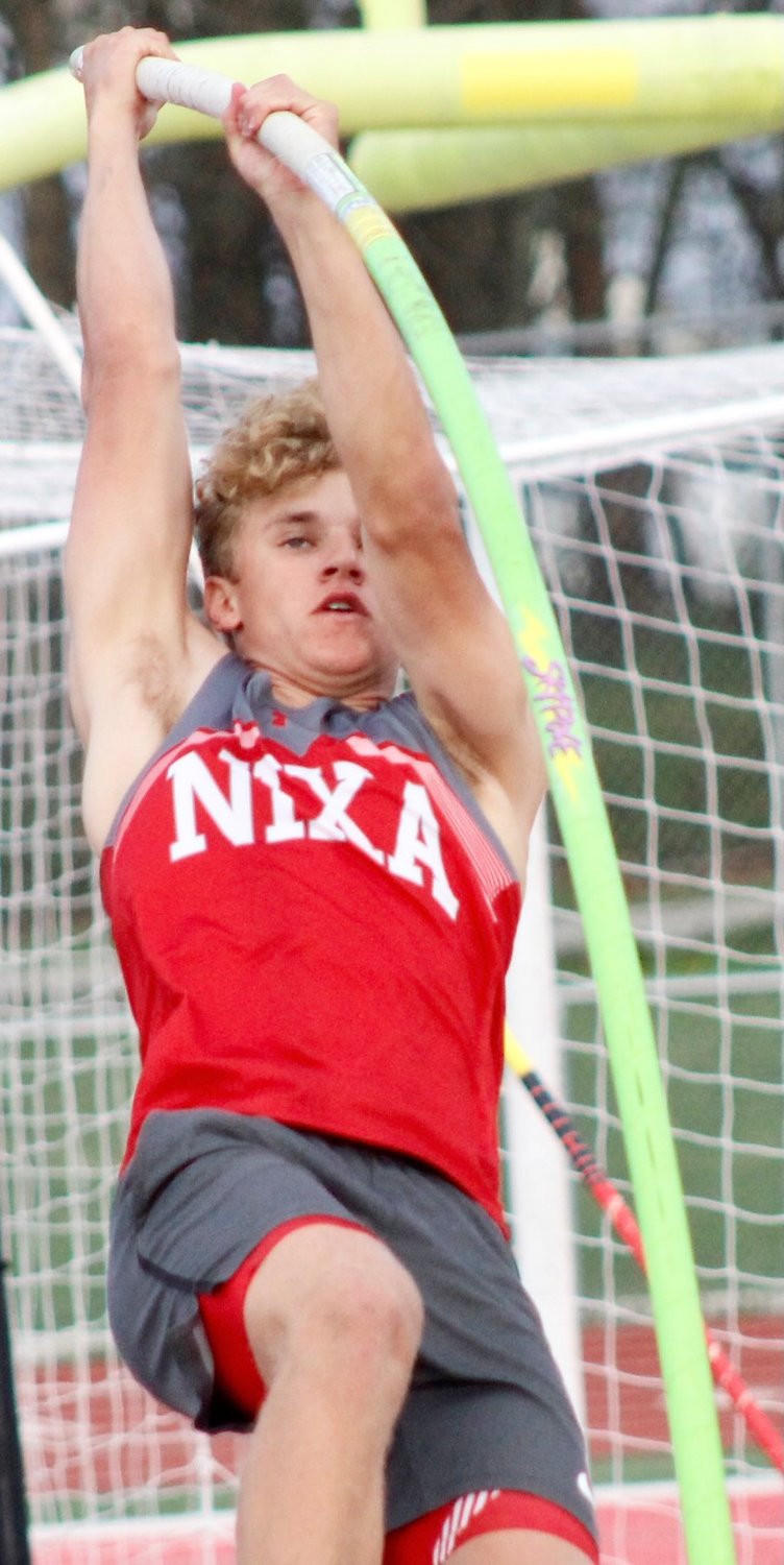 NXIA'S AFTON HOPKINS takes off in the pole vault