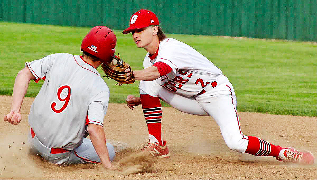 OZARK'S KANNON LITTLE applies a tag at second base on Nixa's Alex Thomason in the teams' matchup Tuesday. Thomason was called safe on the play.