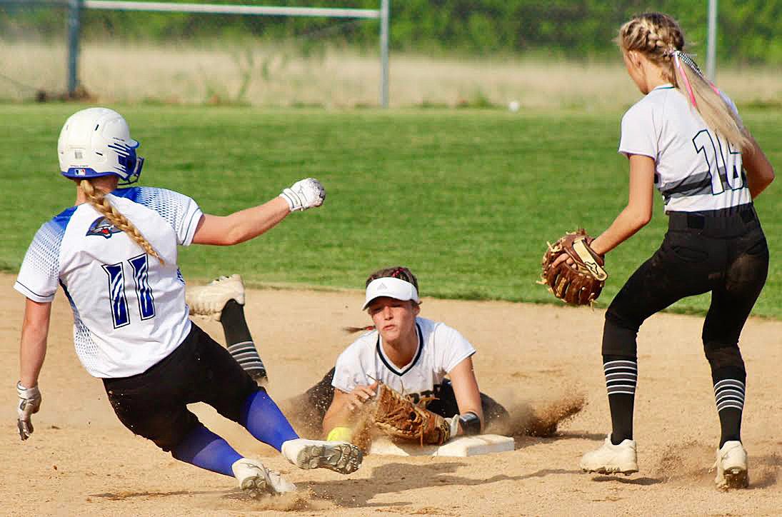 SPARTA'S MEGAN BROWN tries to gain control of the ball at second base.